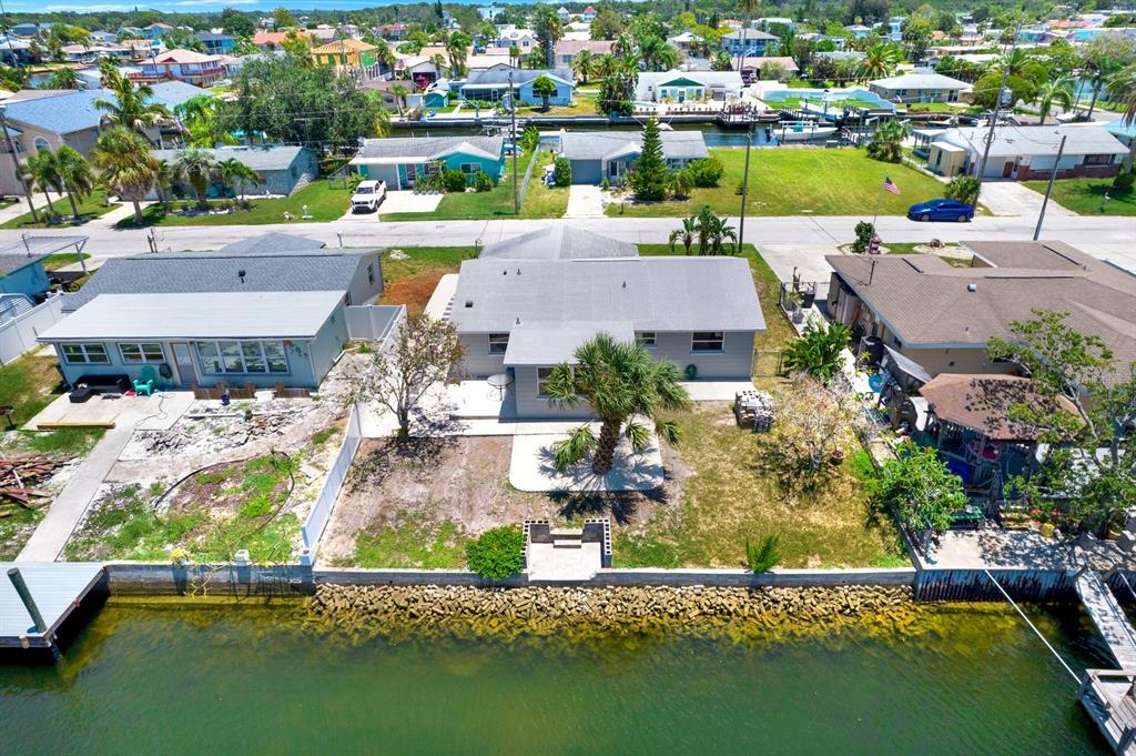 13739 Lavender Avenue Hudson, FL 34667 - Photo 23 of 25 an aerial view of residential houses with outdoor space and swimming pool