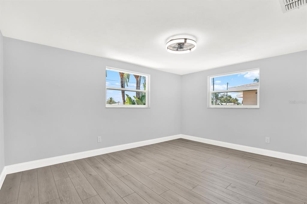 13739 Lavender Avenue Hudson, FL 34667 - Photo 9 of 25 a view of a room with wooden floor and window