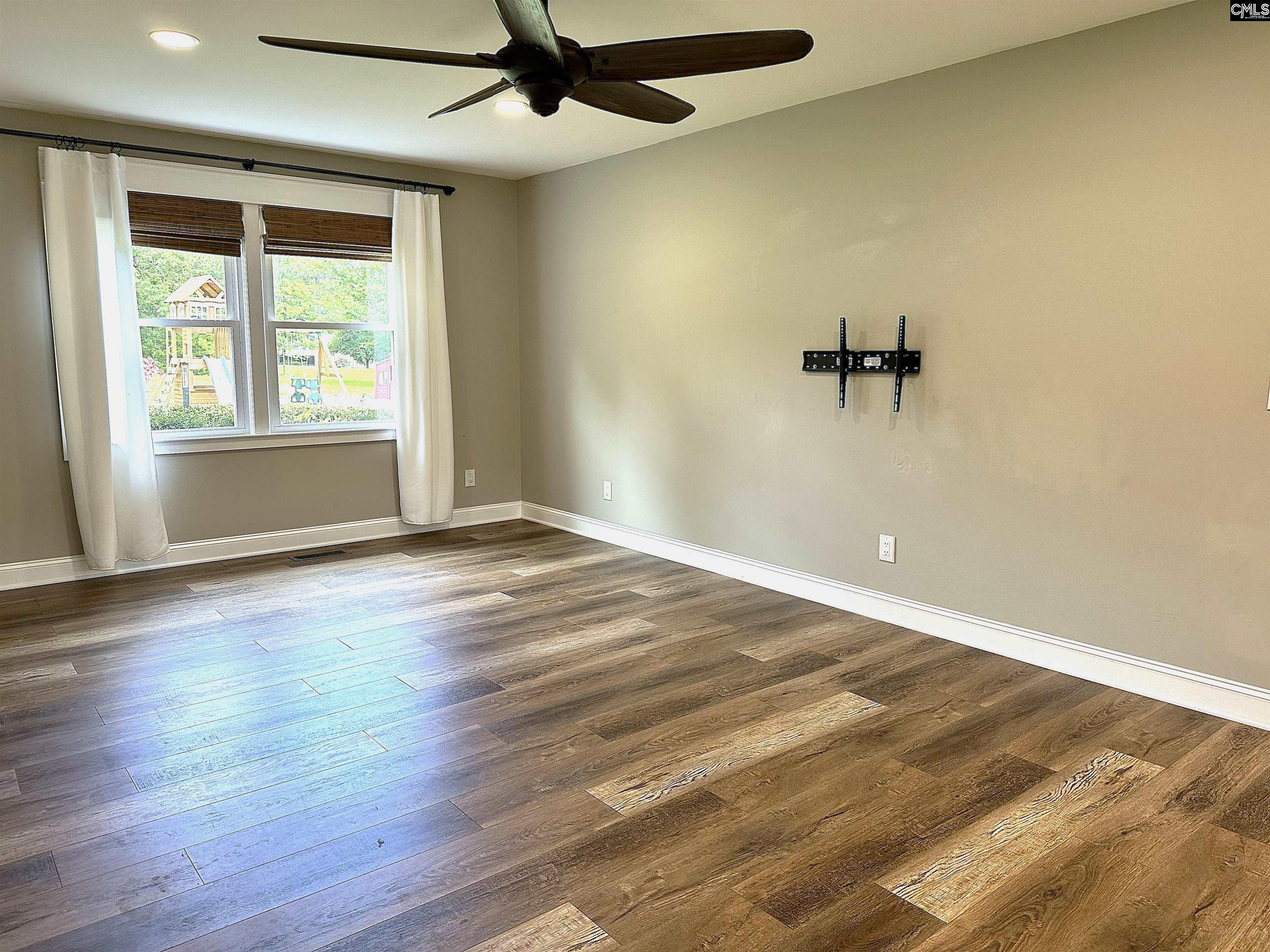 535 Sandbar Road Chapin, SC 29036 - Photo 14 of 23 wooden floor in an empty room with a window