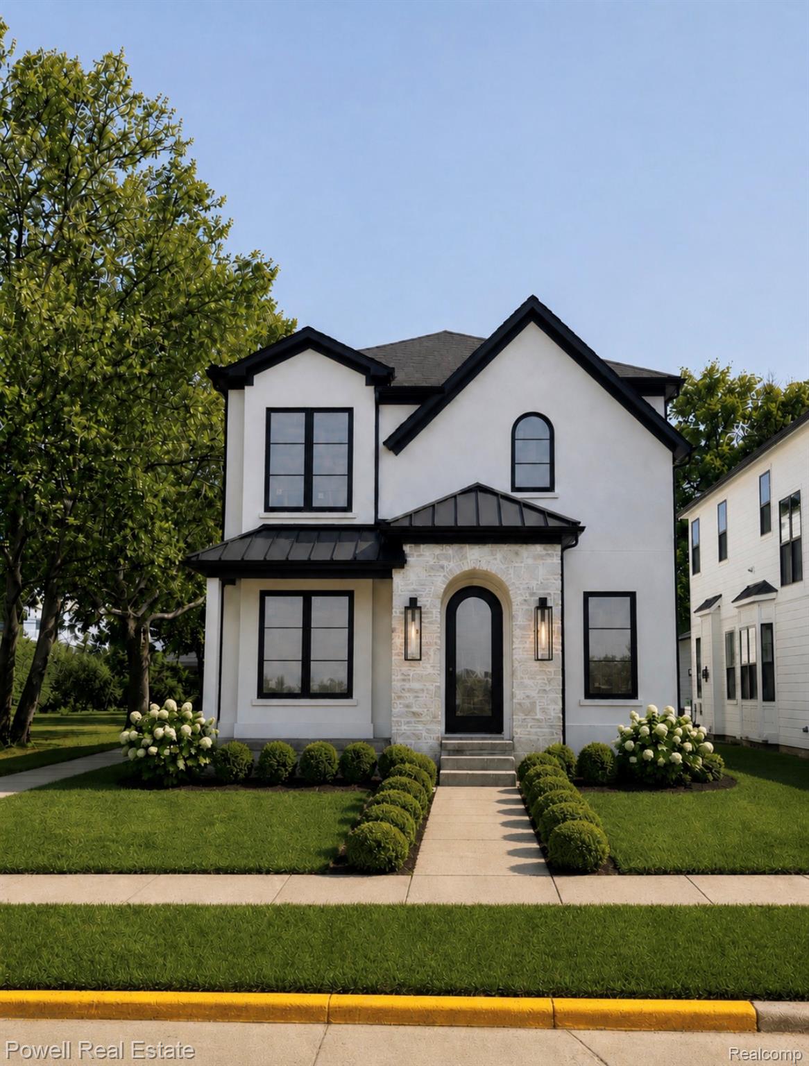 1998 Hazel Street Birmingham, MI 48009 - Photo 1 of 22 AI enhanced photo to add landscaping and finishes.
White stucco exterior with black trim, a gabled roofline, and a stone-clad entry arch