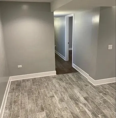 a white toilet sitting next to a bathroom sink and vanity