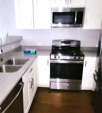 a kitchen with a stove and a microwave