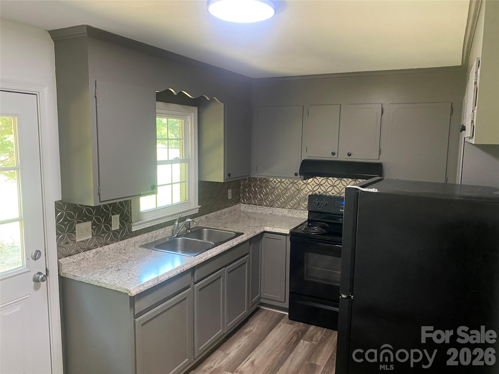 788 Coley Road Salisbury, NC 28146 - Photo 11 of 43 a kitchen with a sink and cabinets