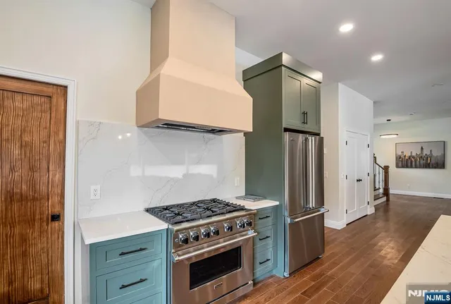 a kitchen with a stove and a refrigerator