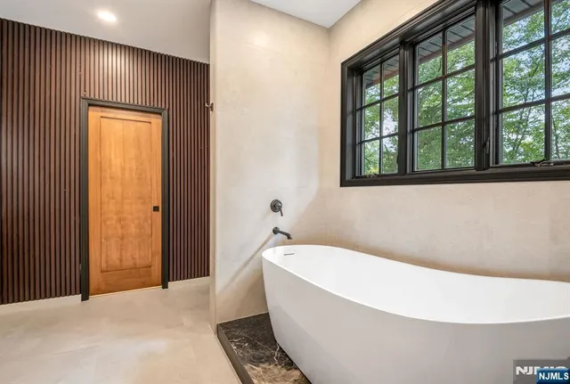 a white bath tub sitting in a bathroom