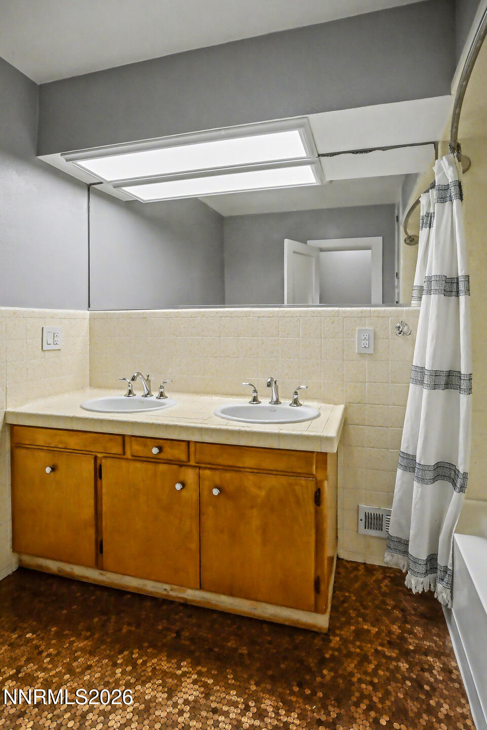 65 South Bailey Street Fallon, NV 89406 - Photo 15 of 34 a bathroom with a sink a mirror and a toilet