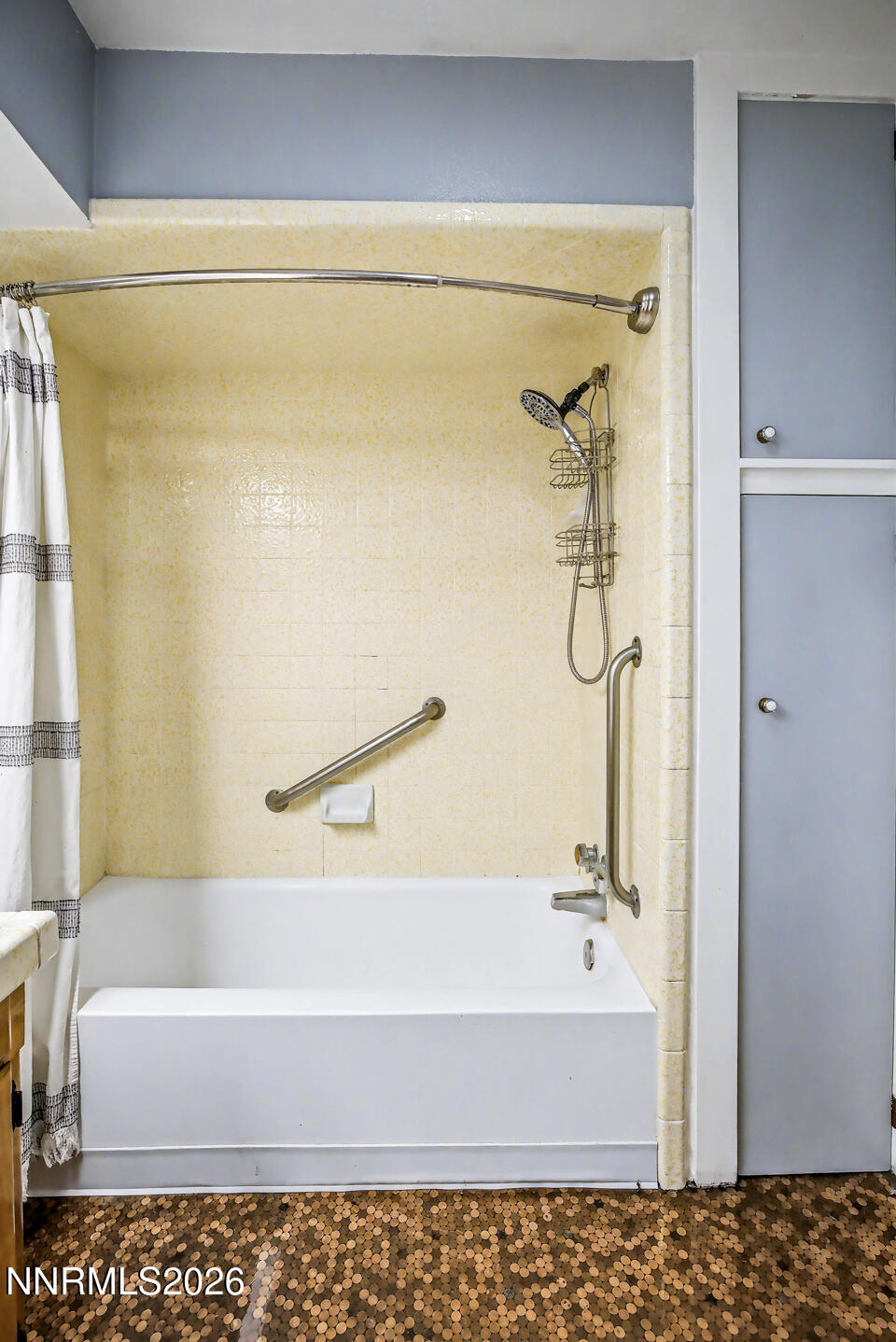 65 South Bailey Street Fallon, NV 89406 - Photo 16 of 34 a bathroom with a bathtub and a shower