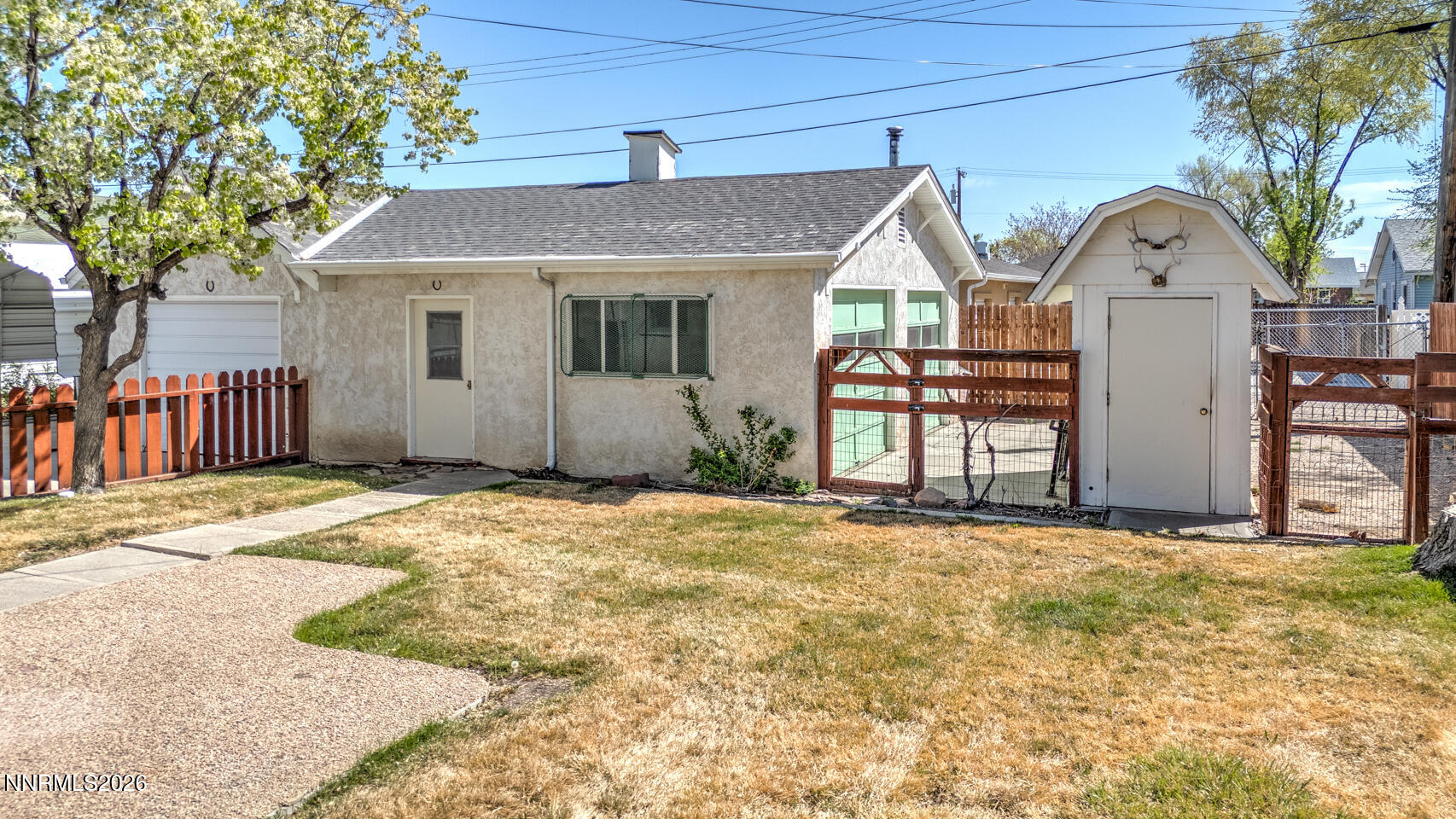 65 South Bailey Street Fallon, NV 89406 - Photo 20 of 34 a view of a house with wooden fence