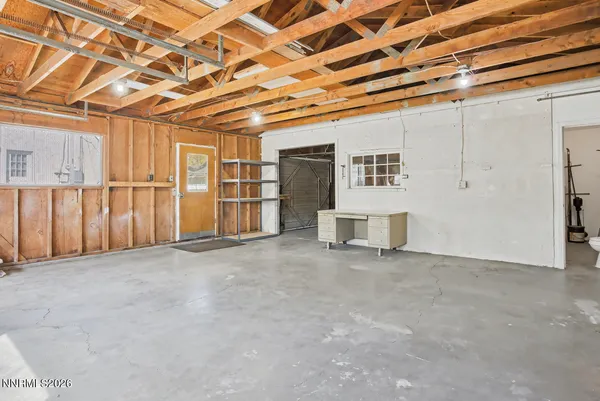 a view of an empty room with wooden walls