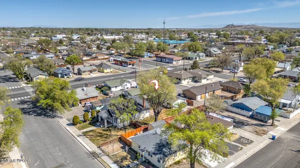 an aerial view of residential houses with outdoor space