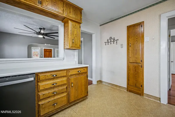a view of a room with wooden floor and windows