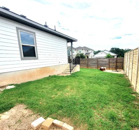 a view of a backyard with sitting area