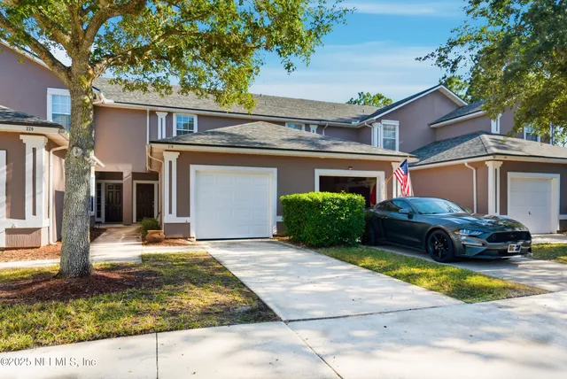 a view of a car parked in front of a house