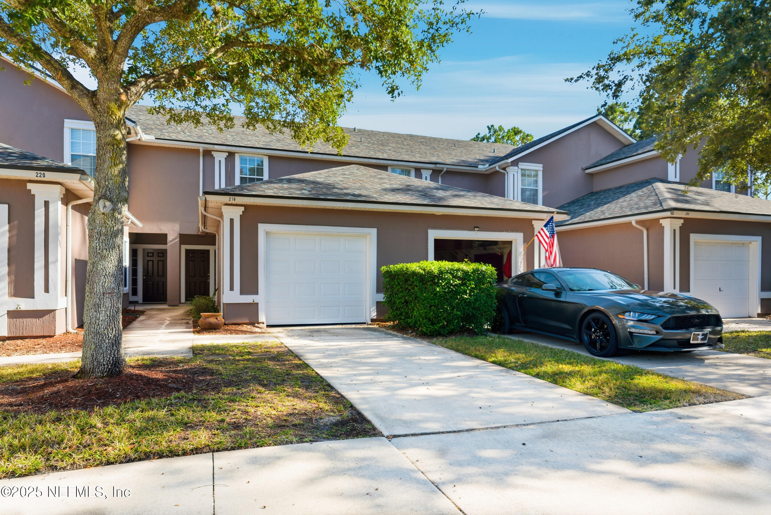 a view of a car parked in front of a house