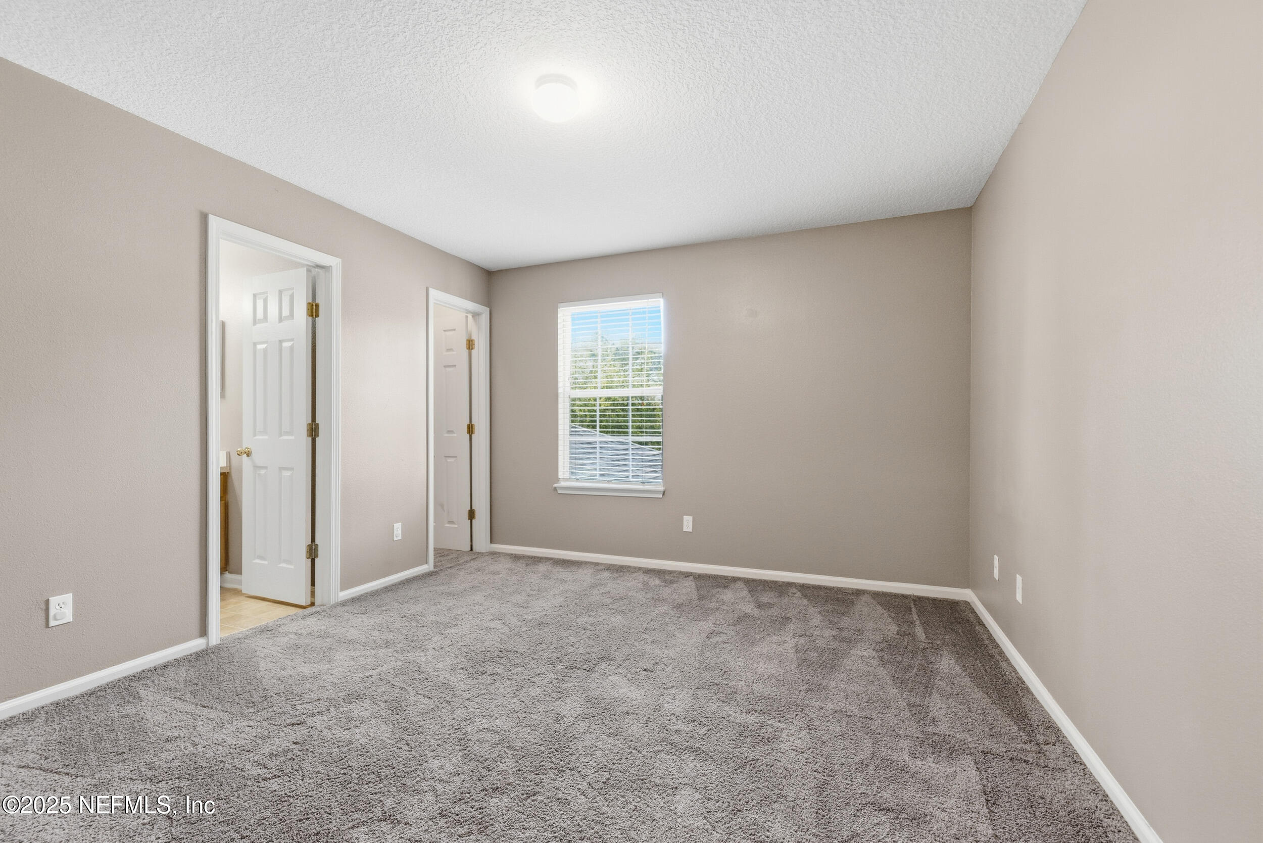 216 Scrub Jay Drive St. Augustine, FL 32092 - Photo 15 of 27 an empty room with windows