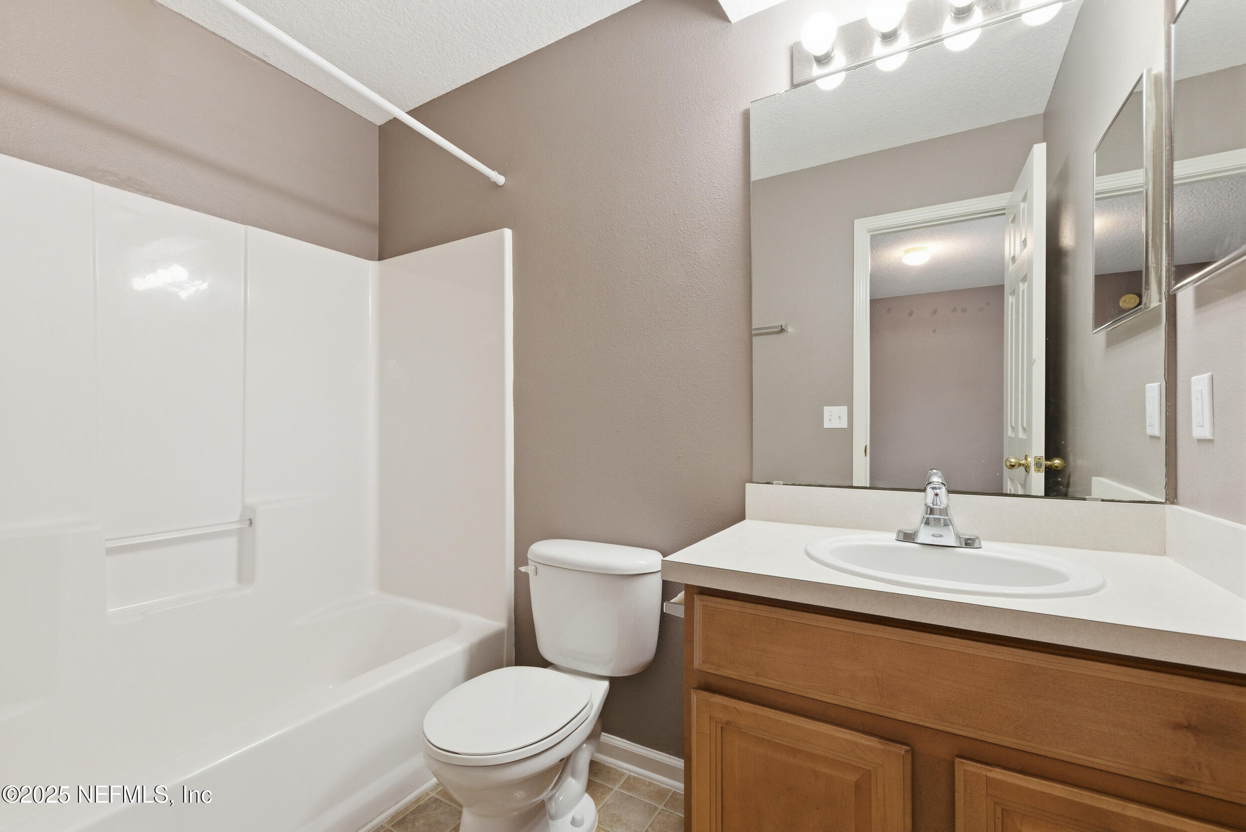 216 Scrub Jay Drive St. Augustine, FL 32092 - Photo 17 of 27 a bathroom with a sink toilet and shower