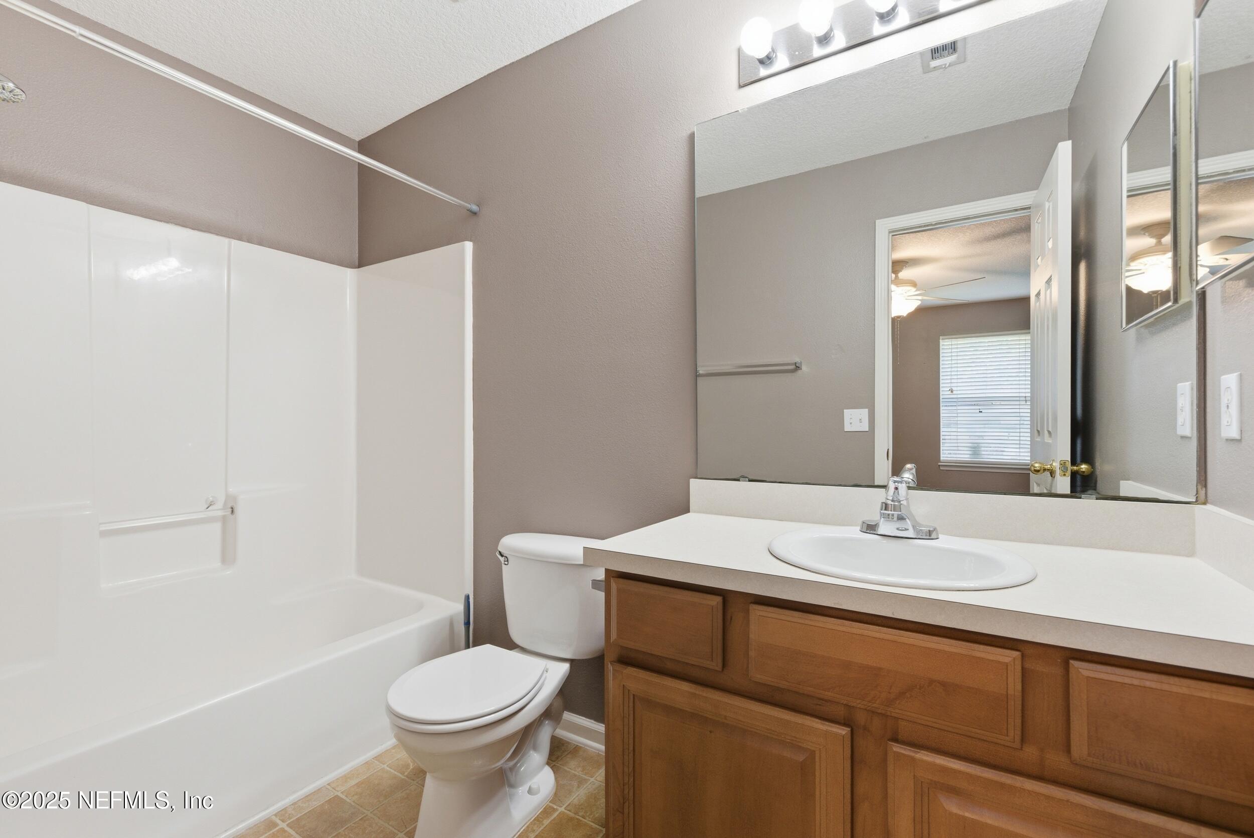 216 Scrub Jay Drive St. Augustine, FL 32092 - Photo 20 of 27 a bathroom with a sink toilet and shower