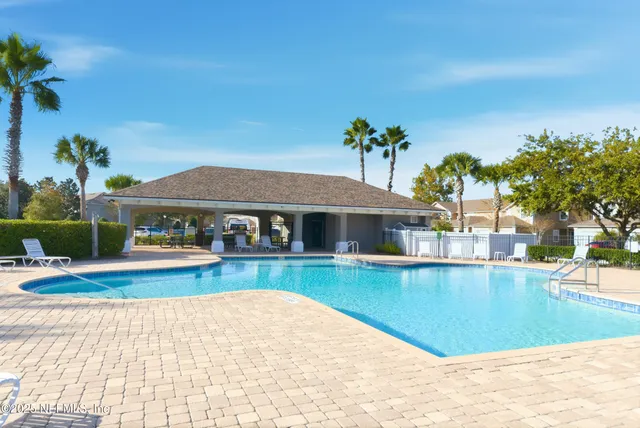a view of a house with swimming pool