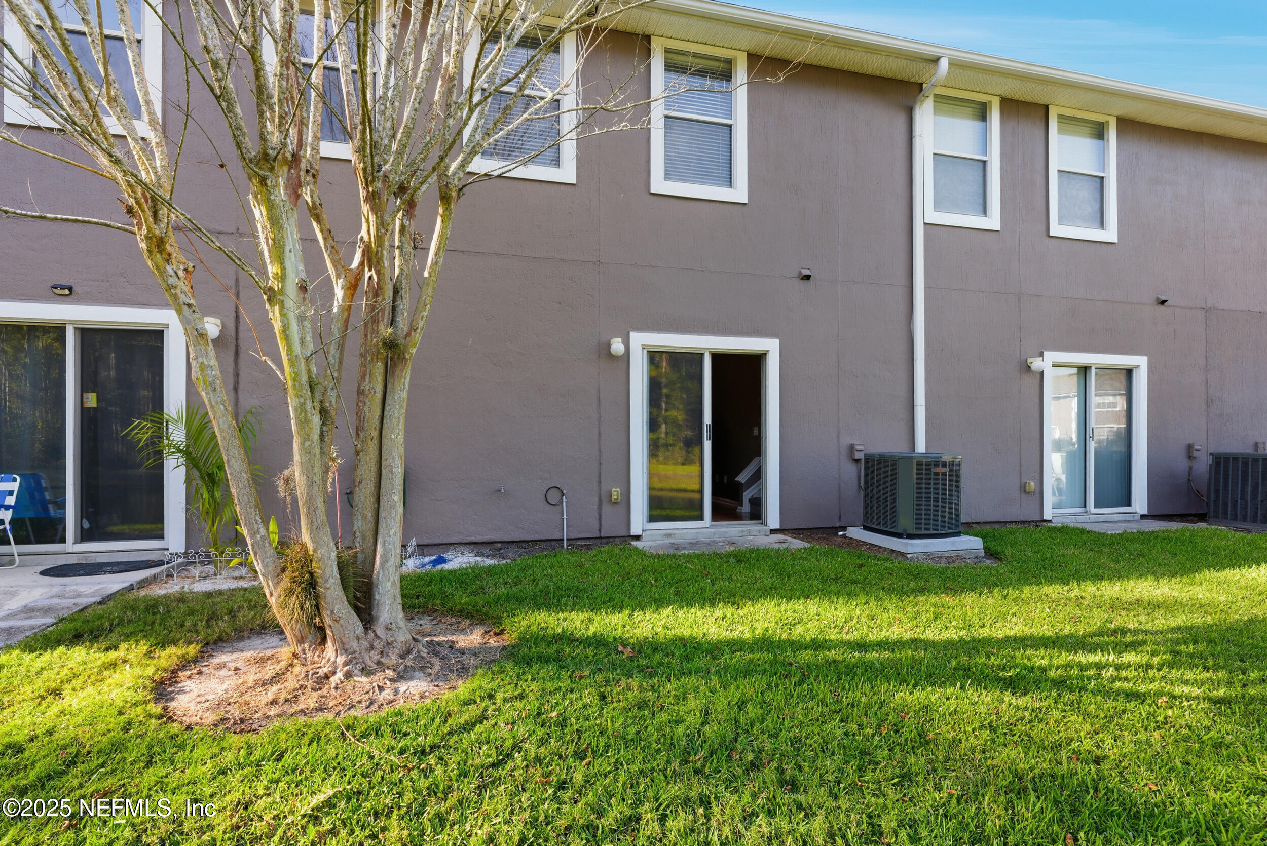 216 Scrub Jay Drive St. Augustine, FL 32092 - Photo 21 of 27 a view of a house with a yard and large tree
