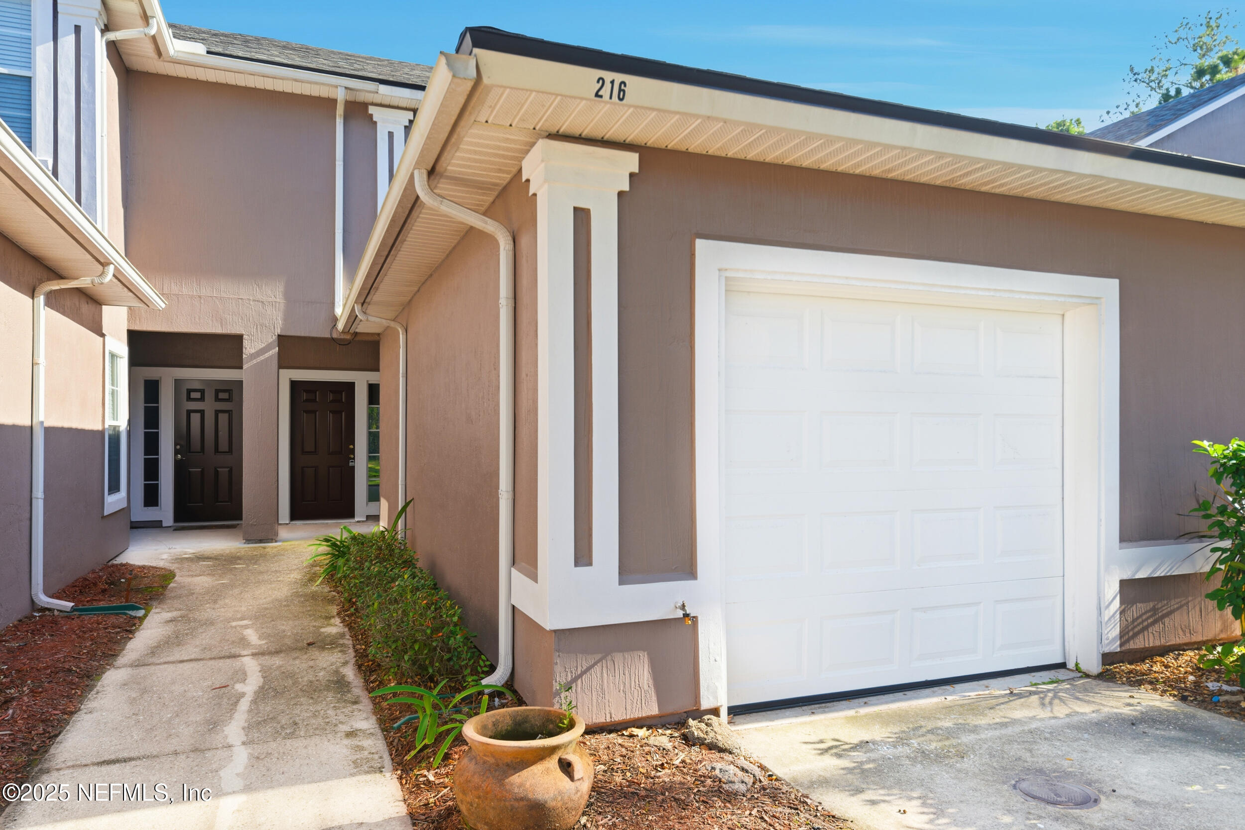 216 Scrub Jay Drive St. Augustine, FL 32092 - Photo 3 of 27 a front view of a house with a yard