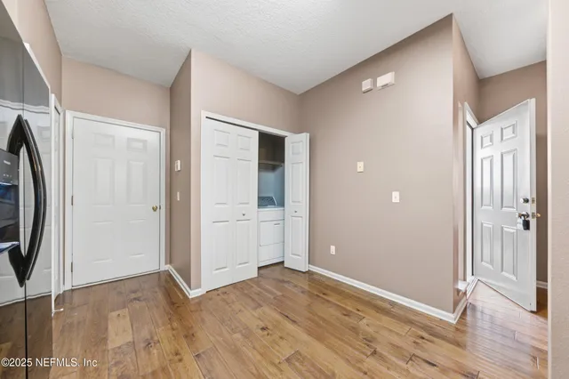 a view of entryway with wooden floor