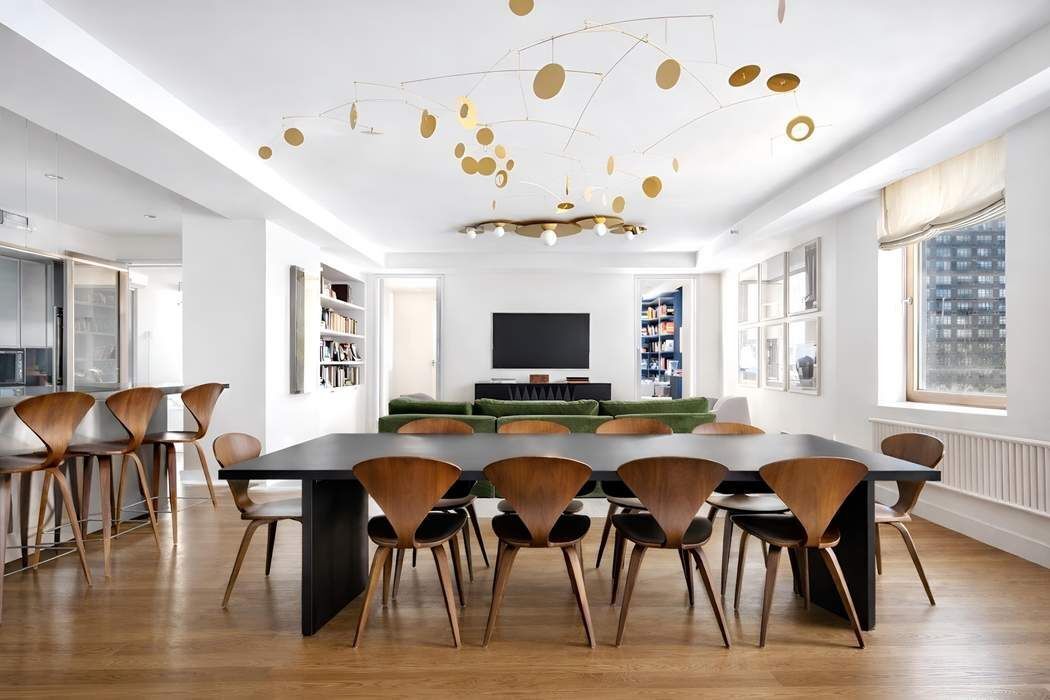 145 6th Avenue, Unit 5D Manhattan, NY 10013 - Photo 2 of 9 a view of a dining room with furniture and wooden floor