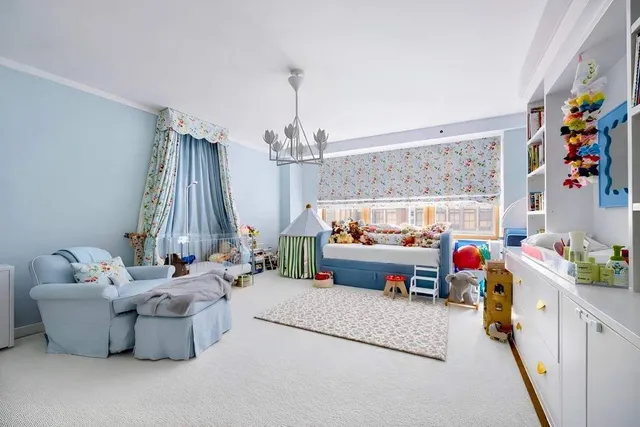 a bed room with a bed and a large window