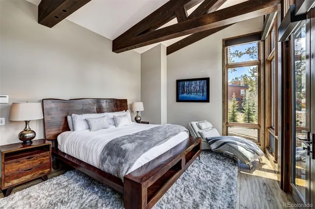 a bedroom with double bed and a window