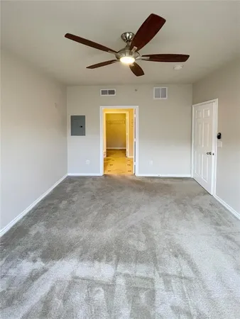 a view of an empty room with a window