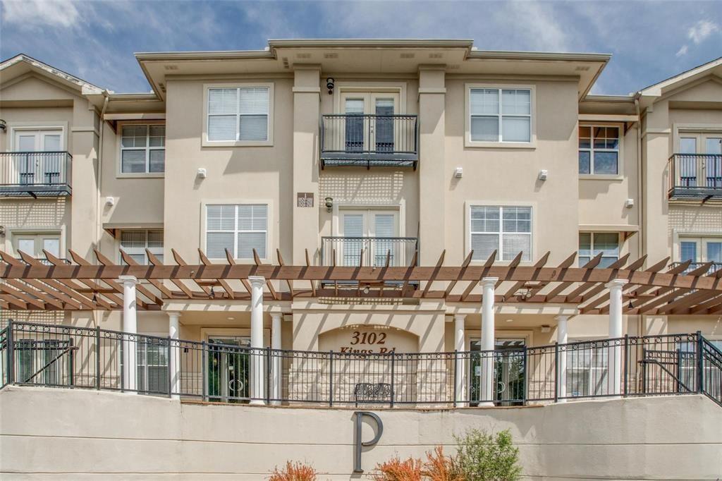 3102 Kings Road, Unit 2208 Dallas, TX 75219 - Photo 2 of 19 a view of a brick building next to a yard
