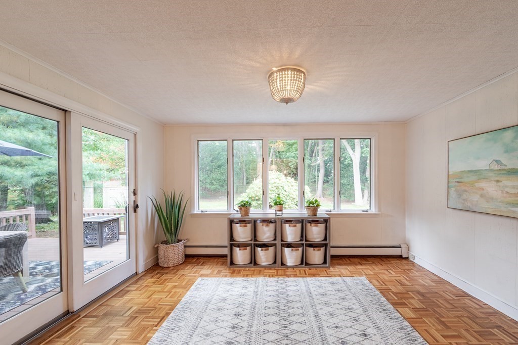63 Maple Ridge Road Reading, MA 01867 - Photo 17 of 41 a living room with furniture and a rug