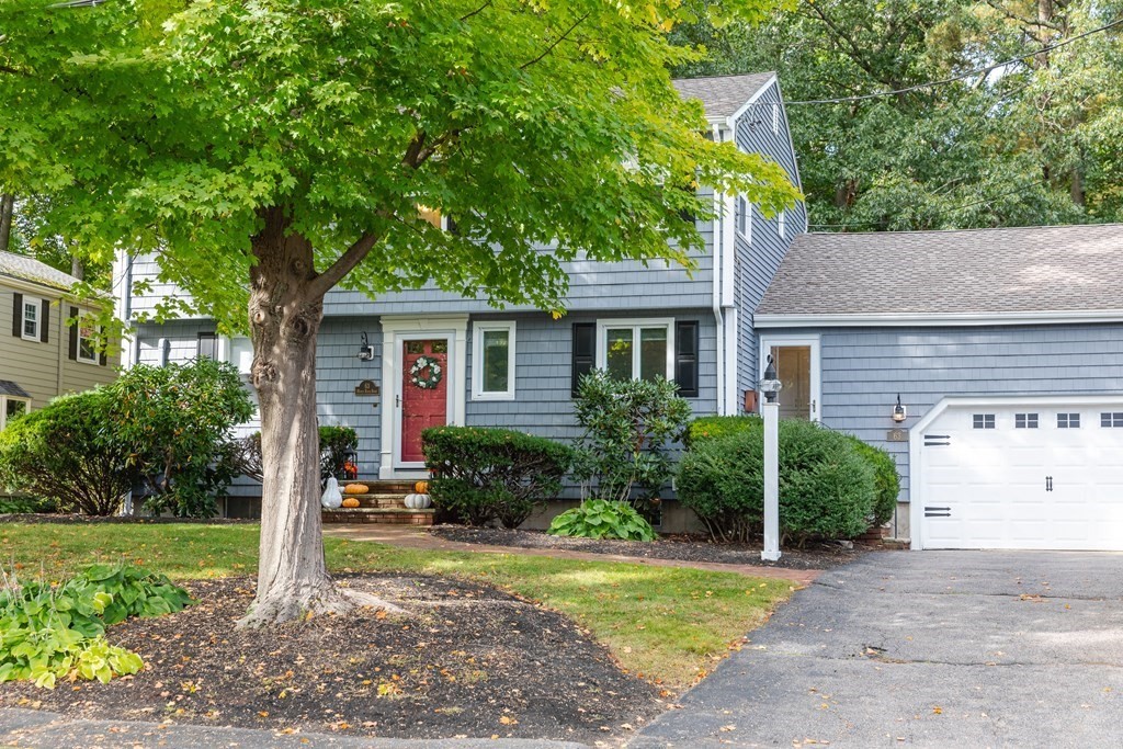 63 Maple Ridge Road Reading, MA 01867 - Photo 2 of 41 a front view of house with yard and green space