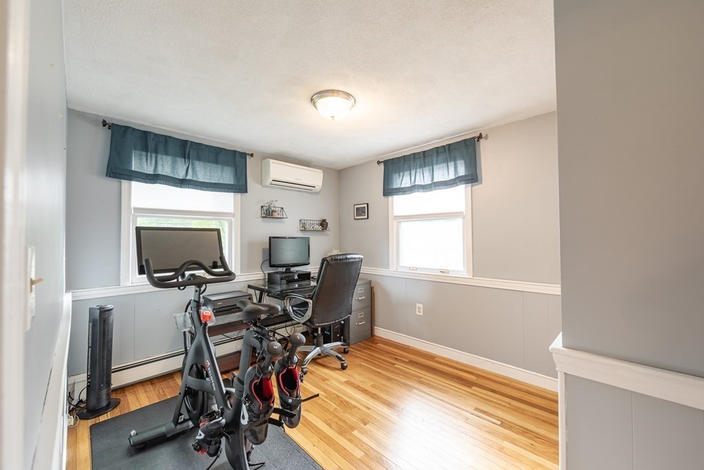 63 Maple Ridge Road Reading, MA 01867 - Photo 23 of 41 a view of a workspace with furniture and a window