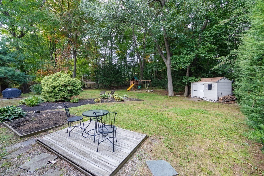 63 Maple Ridge Road Reading, MA 01867 - Photo 31 of 41 a view of a backyard with sitting area