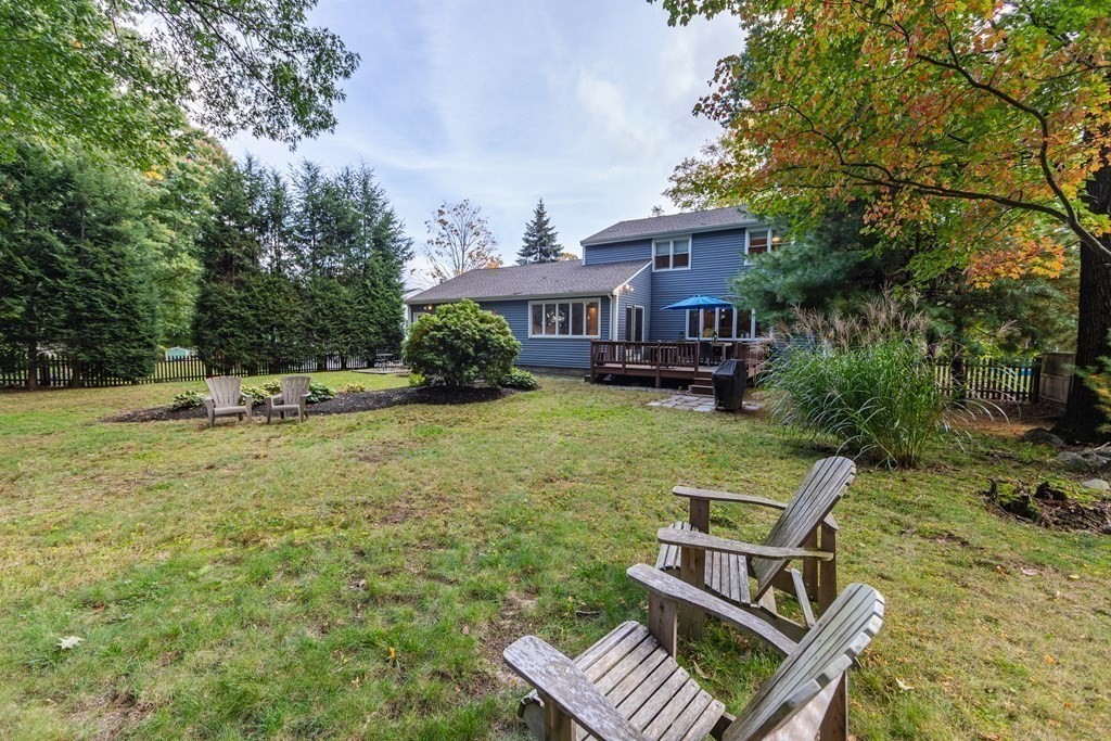 63 Maple Ridge Road Reading, MA 01867 - Photo 38 of 41 a view of a house with backyard and sitting area