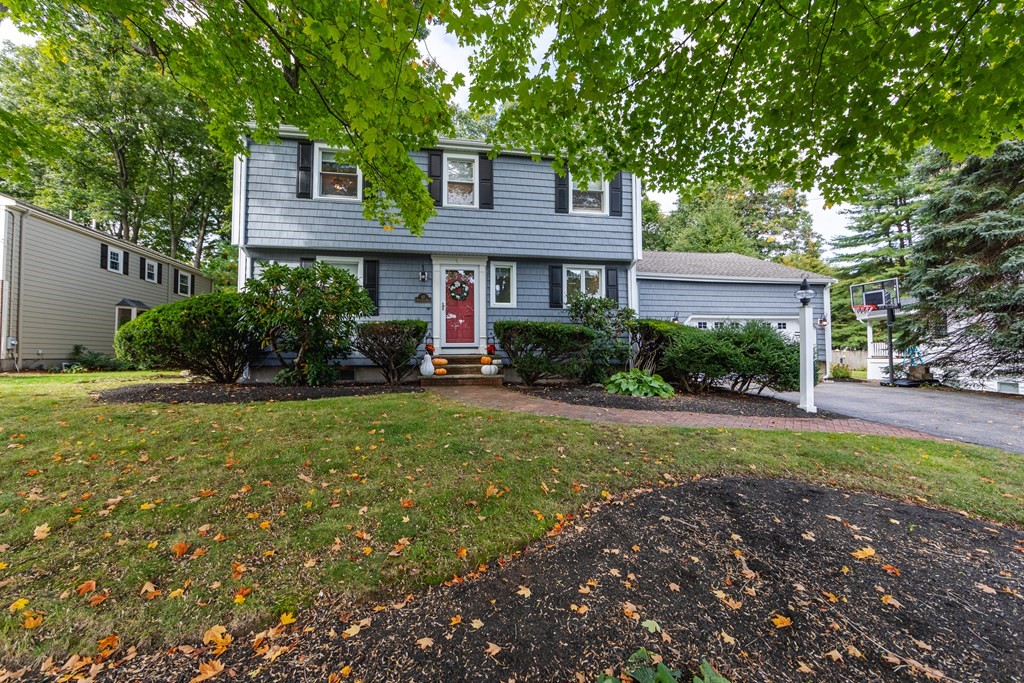 63 Maple Ridge Road Reading, MA 01867 - Photo 4 of 41 a view of a house with a garden