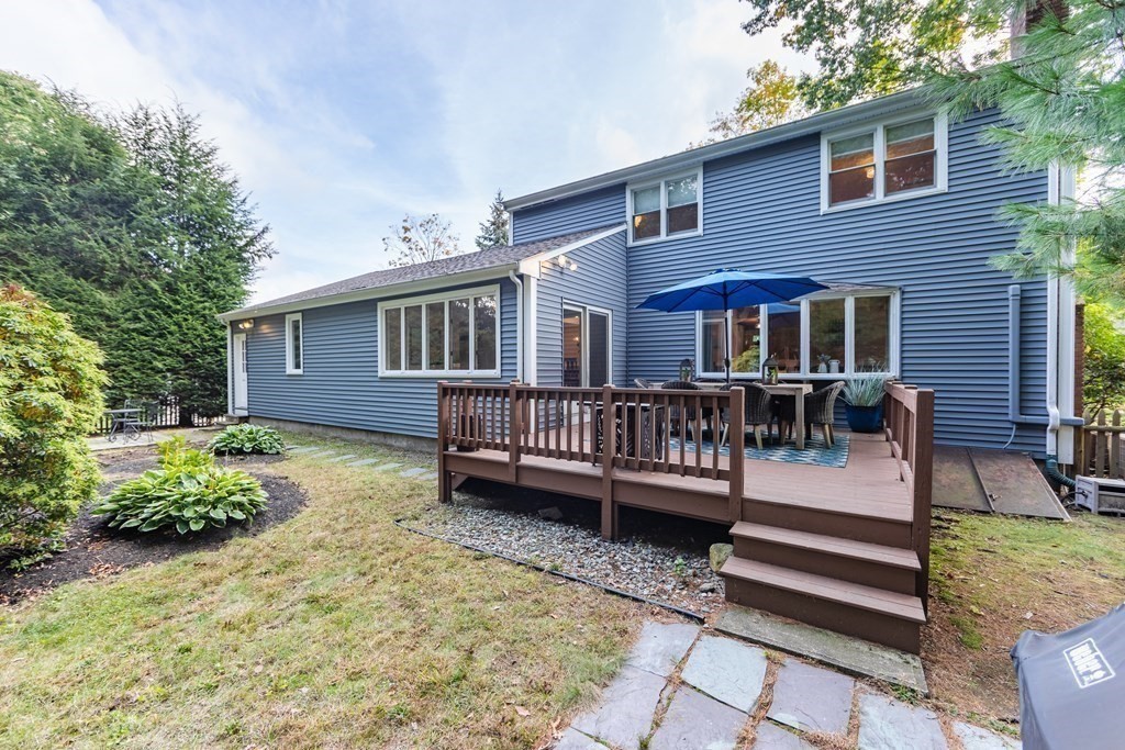 63 Maple Ridge Road Reading, MA 01867 - Photo 41 of 41 a view of a house with a yard and sitting area