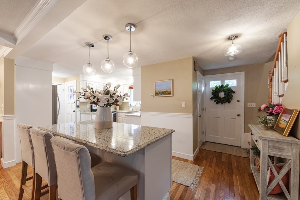 63 Maple Ridge Road Reading, MA 01867 - Photo 7 of 41 a dining room with furniture and wooden floor