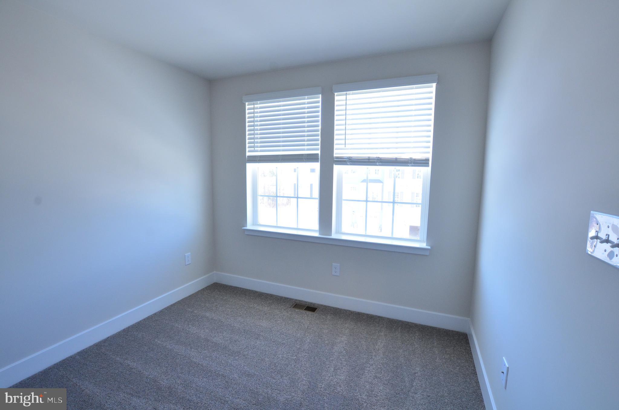 7605 River Reach Road Baltimore, MD 21244 - Photo 21 of 29 an empty room with a window