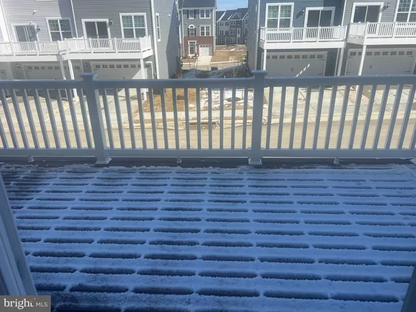 a view of a balcony with wooden floor