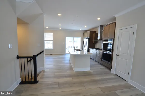 a living room with fireplace furniture and a wooden floor
