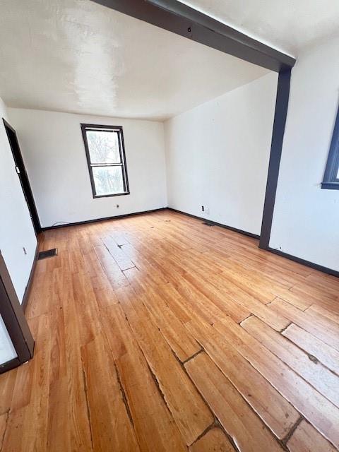 22 West Coffee Street Uniontown, PA 15401 - Photo 2 of 8 a view of an empty room with wooden floor and a window