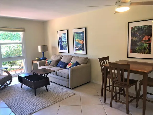 a living room with furniture and a window