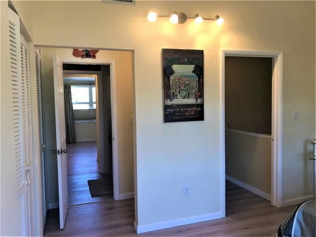 a view of a pathway of a house with a yard