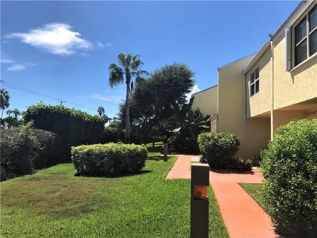a view of a back yard of the house