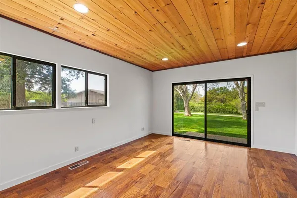 a bedroom with a large bed and a large window