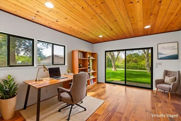 a bed room with bed and a large window