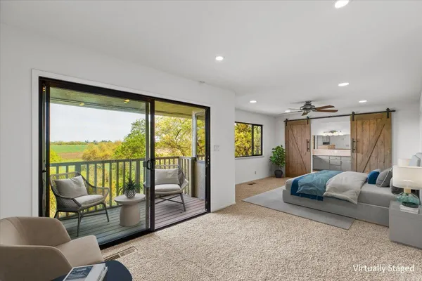 a view of backyard with table and chairs