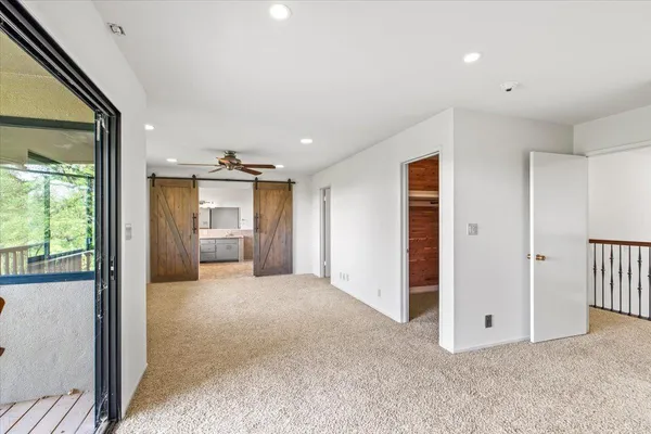 an aerial view of ocean with residential houses with outdoor space and swimming pool