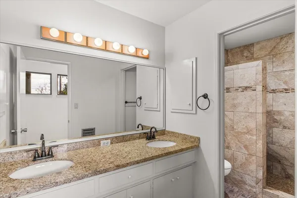 a view of a house with a backyard porch and sitting area